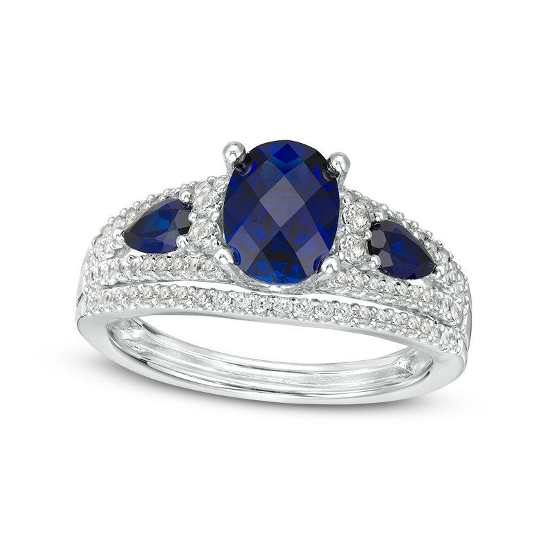 Image of ID 1 Oval Lab-Created Blue Sapphire and 050 CT TW Diamond Three Stone Ring in Solid 10K White Gold