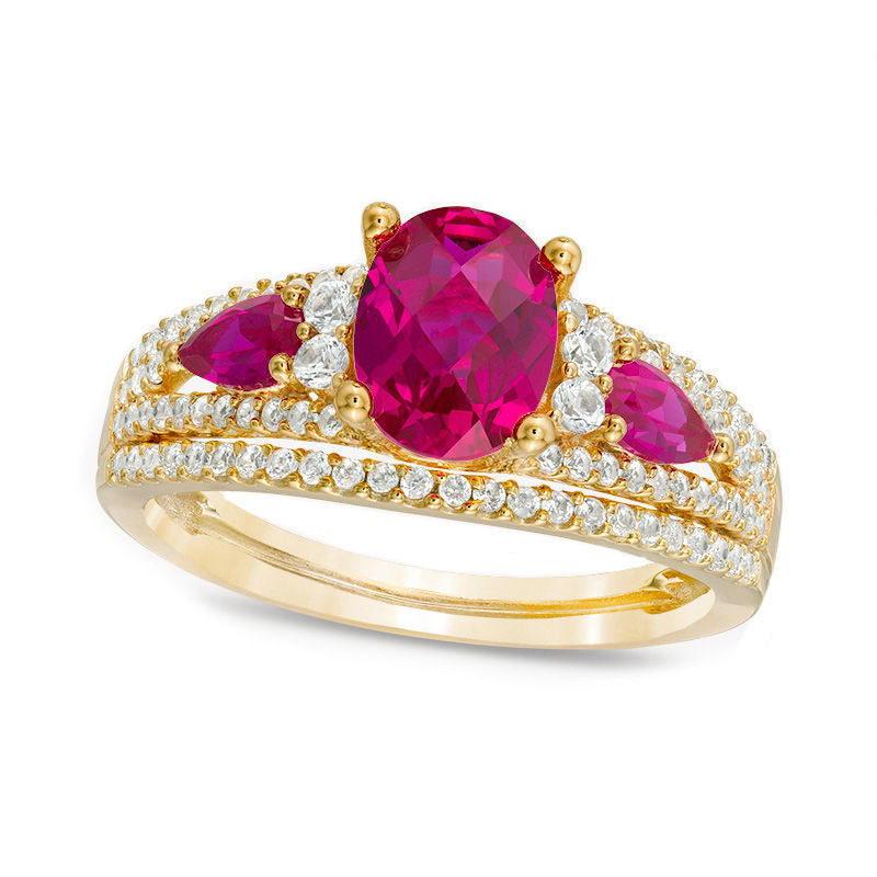 Image of ID 1 Oval Lab-Created Ruby and 050 CT TW Diamond Three Stone Ring in Solid 10K Yellow Gold